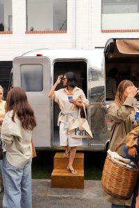 Image of a woman at a pop-up event outside.
